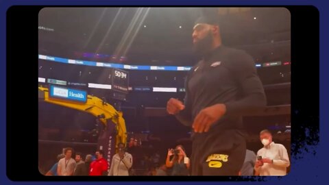 LeBron James gets up a pregame shot and tries to loosen up that sprained left ankle