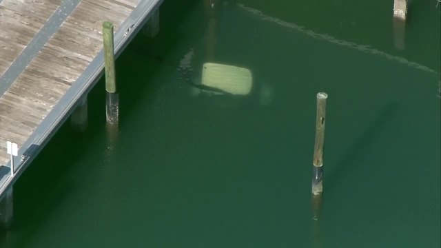 Golf cart submerged at Riviera Beach City Marina