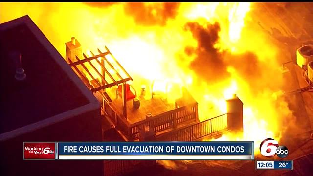 PHOTOS: Roof of condo complex catches fire near downtown Indianapolis