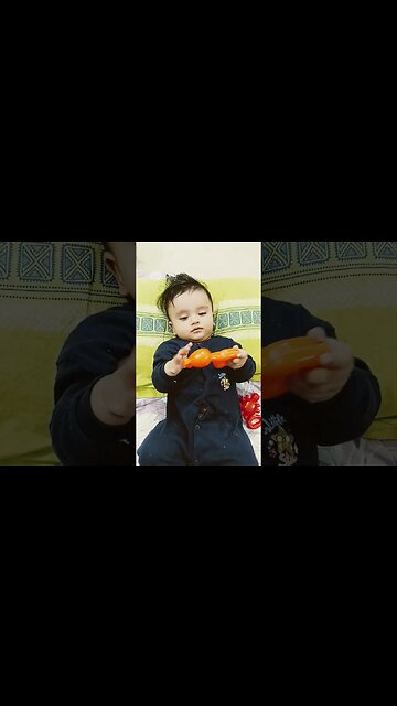 6 months old sleepy baby taking to his toys #shortsvideo #shorts