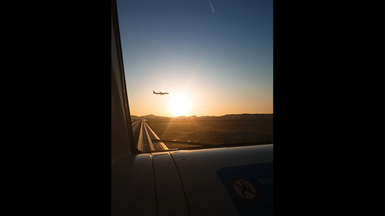 The sunset from the subway and the flying airplane