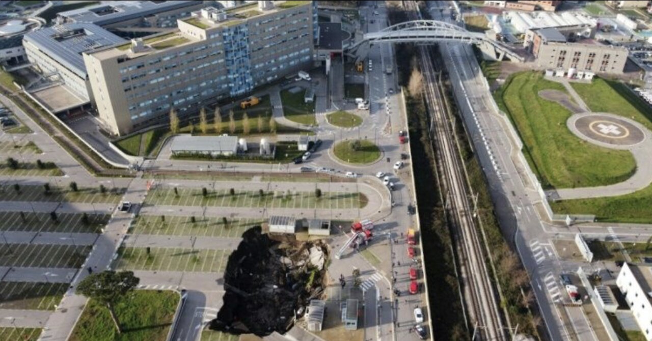 Massive sinkhole swallows at least 3 cars outside hospital in southern Italy