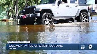 Crews pumping water out of flooded Sea Pines neighborhood in Lantana