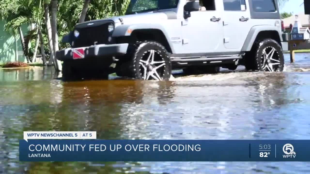 Crews pumping water out of flooded Sea Pines neighborhood in Lantana