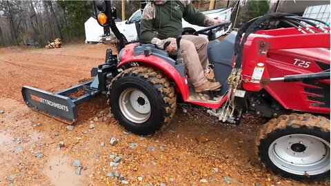 Land Plane Wet Gravel with Small Tractor