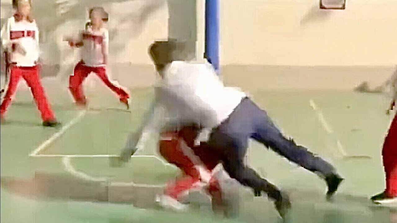 Gavin Newsom PLOWS through a small child during a game of basketball in communist China