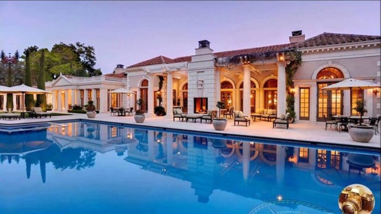 A large, luxurious pool facing the open sea