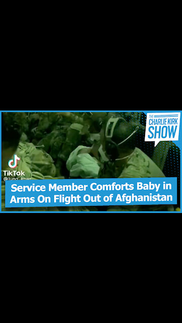 Service Member Comforts Baby in Arms On Flight Out of Afghanistan