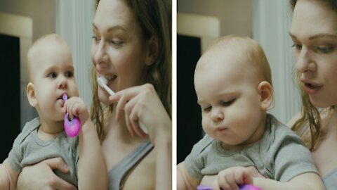 mother teach her baby how to brush