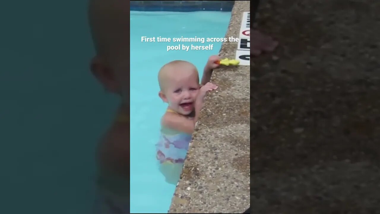 Baby swims across pool