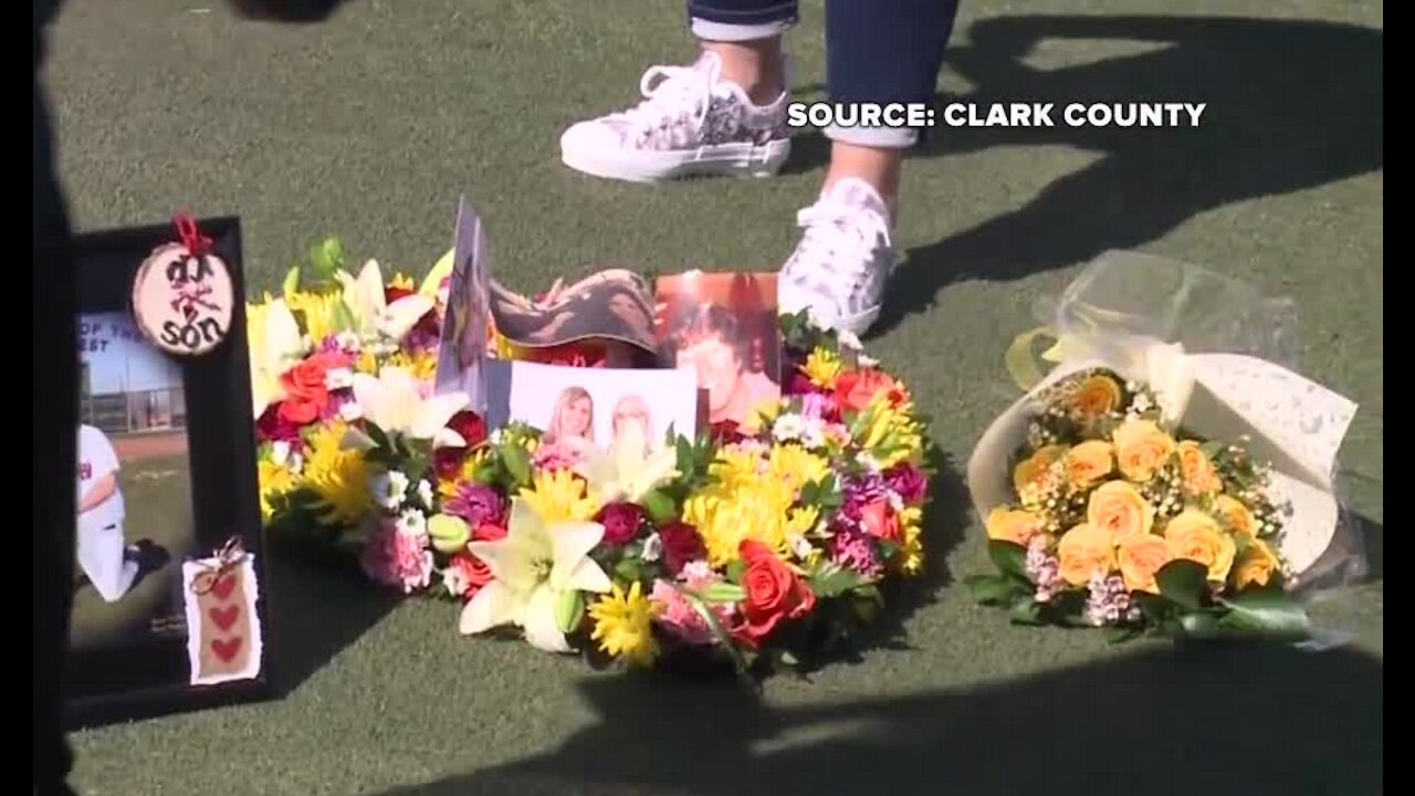 Heart shaped wreath placed in front of Welcome to Las Vegas sign to honor COVID-19 victims