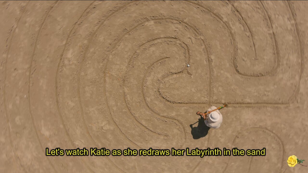 A Drone View of a Lady Drawing a Sand Labyrinth on the Beach at Port Aransas