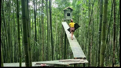 Girl building a tent on top of a bamboo tree- Wild Girl.