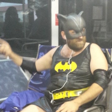 A Guy Dressed As Batgirl Sings A Pop Song