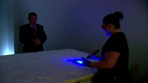 Forensic scientist takes apart refurbished mattress