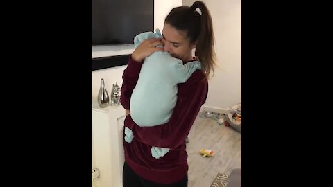 She appears to be holding a baby, but just wait for it!