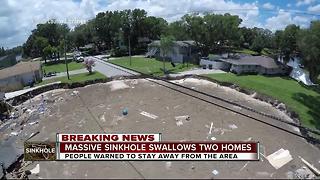 Massive sinkhole swallows two homes