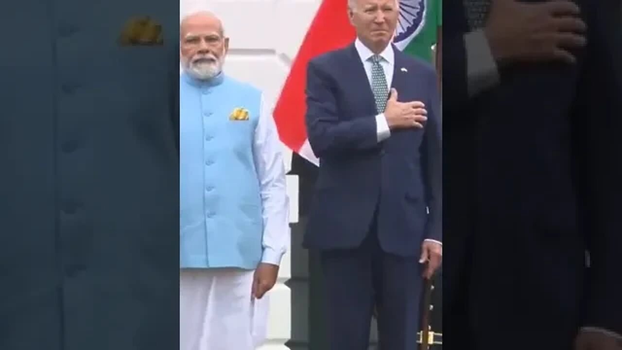 Joe Biden slowly lowers his hand from heart after realizing they're playing Indian national anthem.