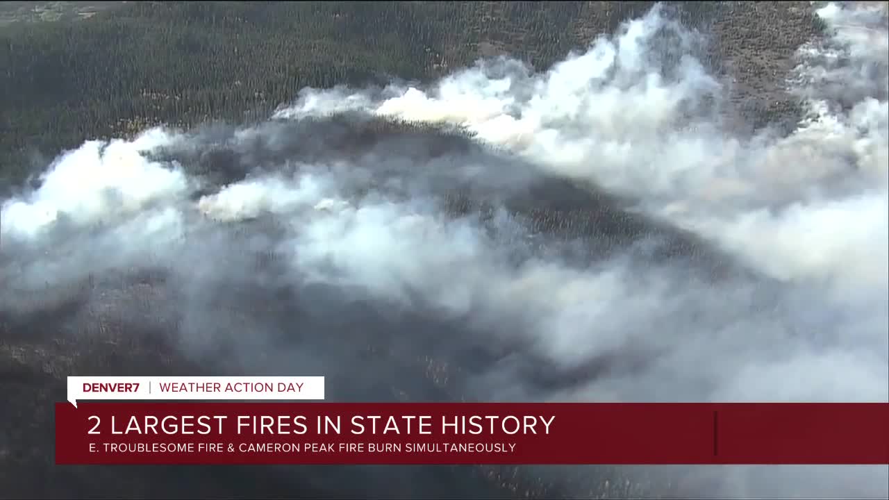 Two of the state's largest wildfires are burning simultaneously