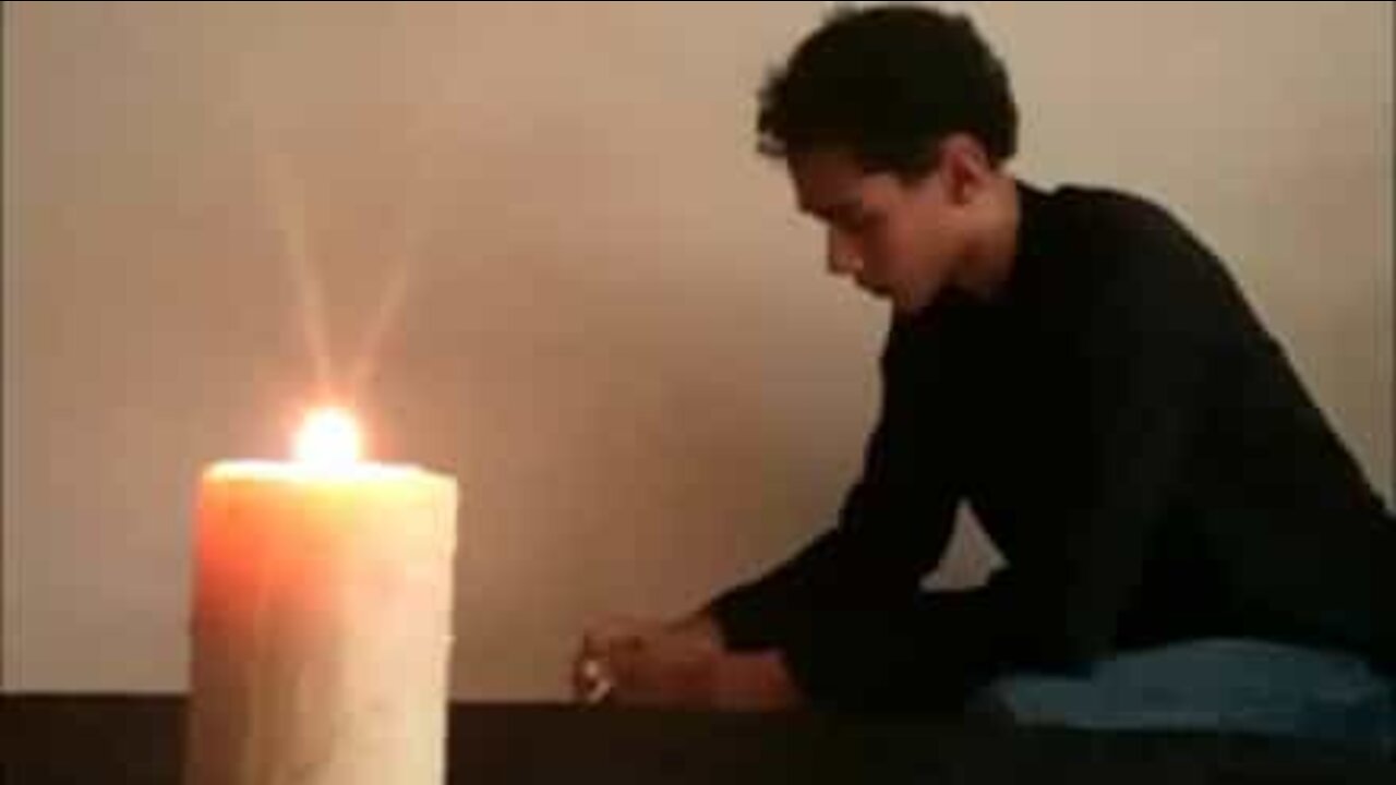 Kid extinguishes candle by throwing cards