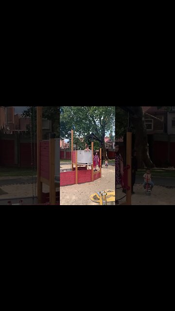 Baby boy and his big sisters play in the park