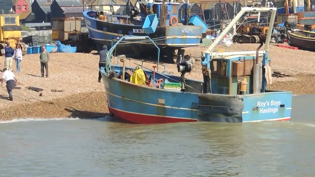 Hastings Fishing Boats Launching From Beach