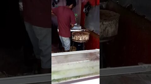 Butcher cutting chicken