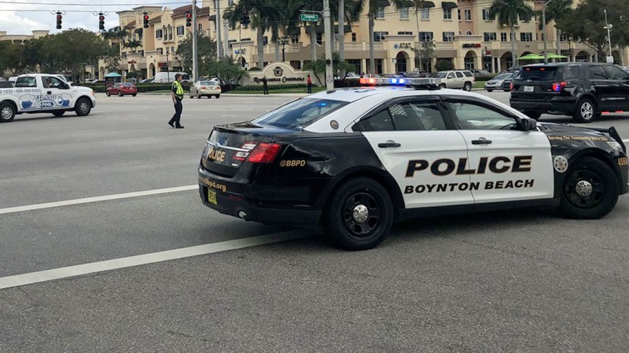 Boynton Beach officer struck by car while chasing suspect in serious condition