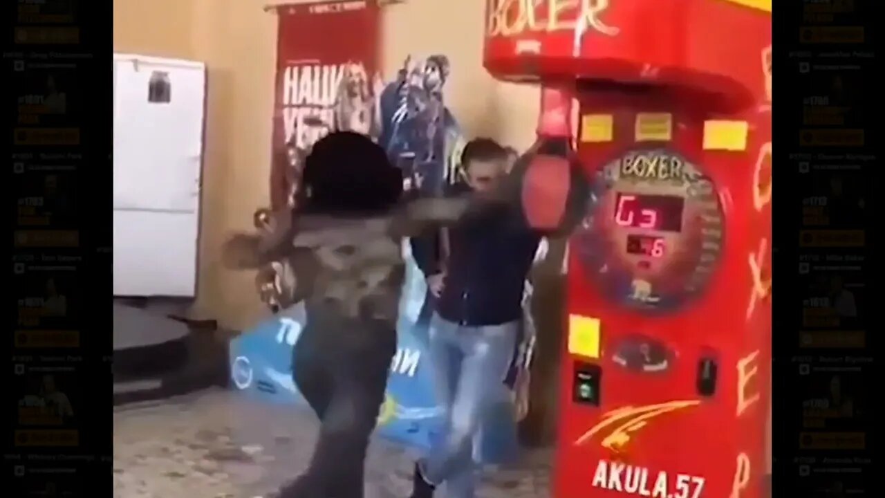 Girl hits boyfriend while playing punching game at arcade.