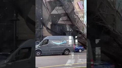 Scaffolding falls from building