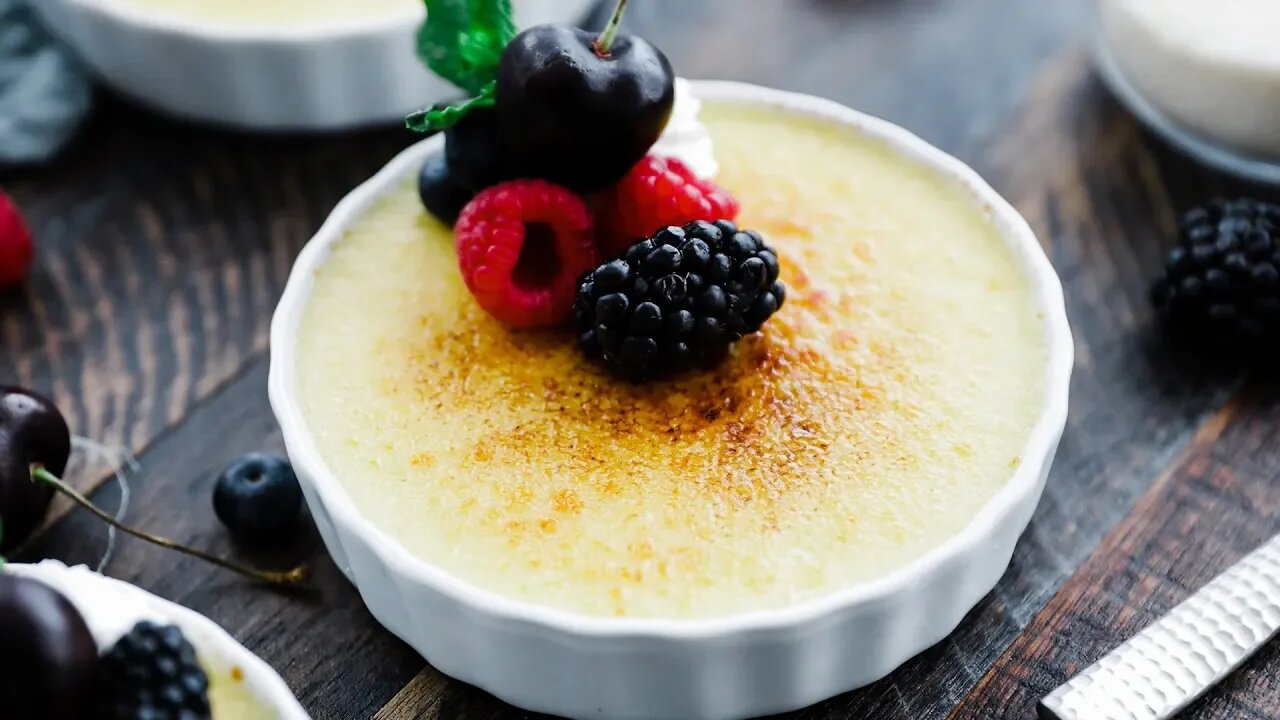 Rumchata Crème Brulee with Whipped Cream and Berries