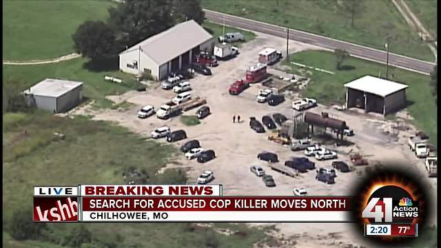 Search for accused cop killer moves north