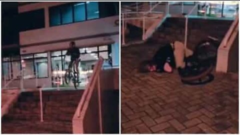 Boy tries to pull off a bike trick and ends up on the ground