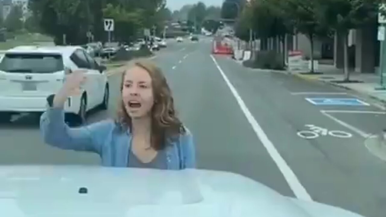 Crazed Leftist Blocks Road And Yells "Black Lives Matter"