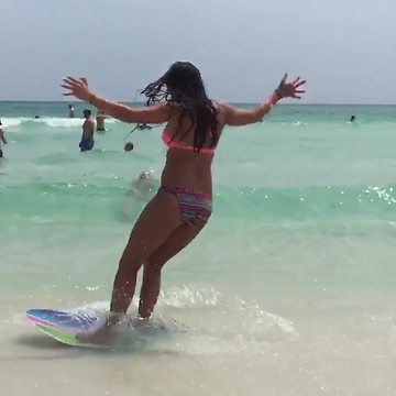 Teen Girl Jumps On A Skim Board But A Wave Washes Her Up