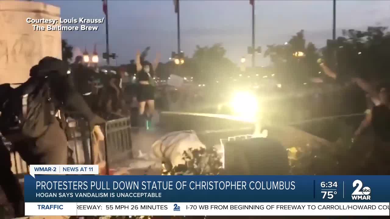 Columbus statue torn down, tossed in harbor