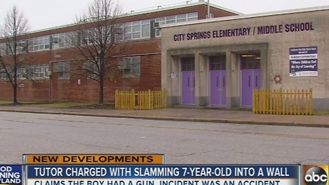 Tutor charged with slamming 7-year-old claims boy had gun