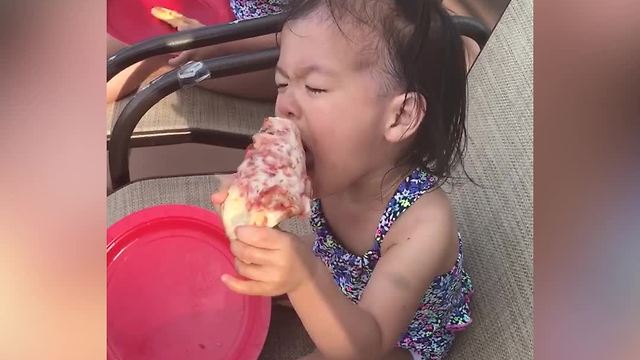 "Tot Girl Struggles To Eat A Slice Of Floppy Pizza"