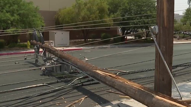 Forklift clips power poles, knocking them over