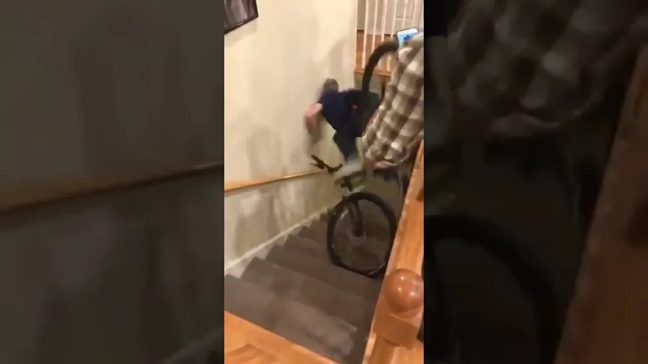 Idiot falls down stairs with bike because gravity is evil