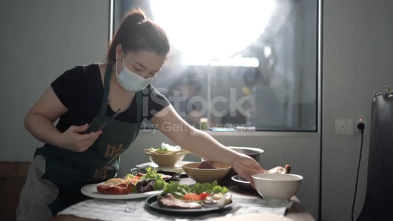 Asian Chinese female vlogger broadcasting decoration food in her home studio