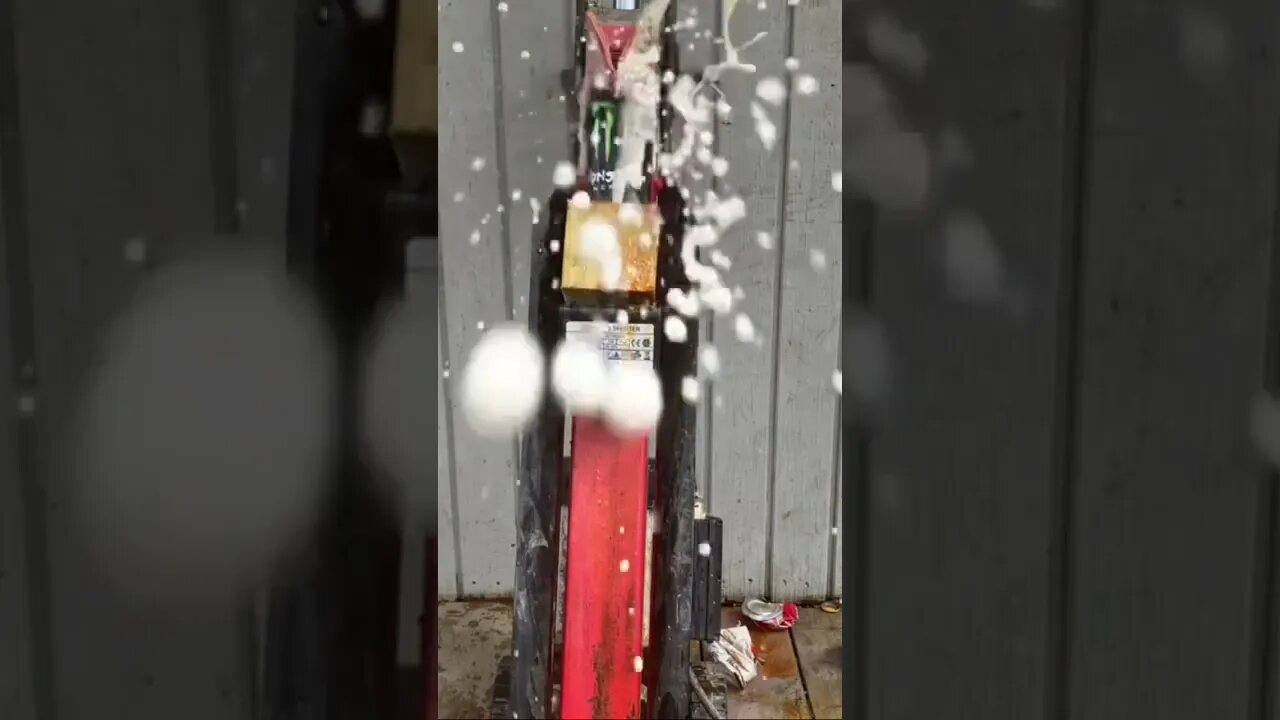 Drink cans being crushed by a log splitter - crazy explosions