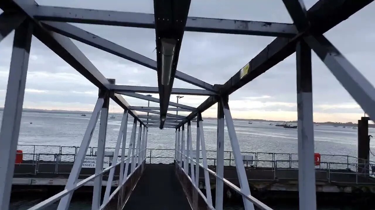 Walking on the pier of the Hayling Island ferry port. Portsmouth.