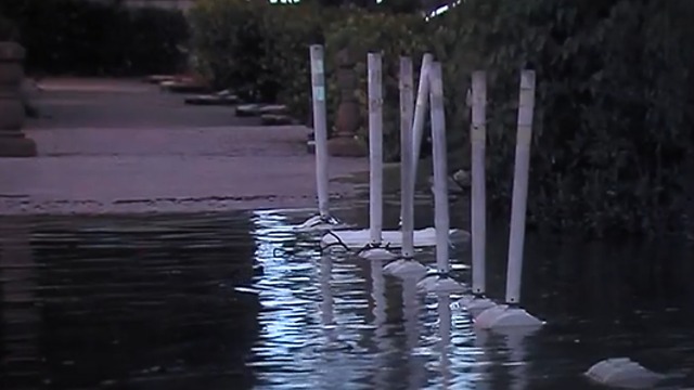 High tides sending water into homes