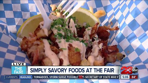 Allison Gargaro tries lobster fries at the fair