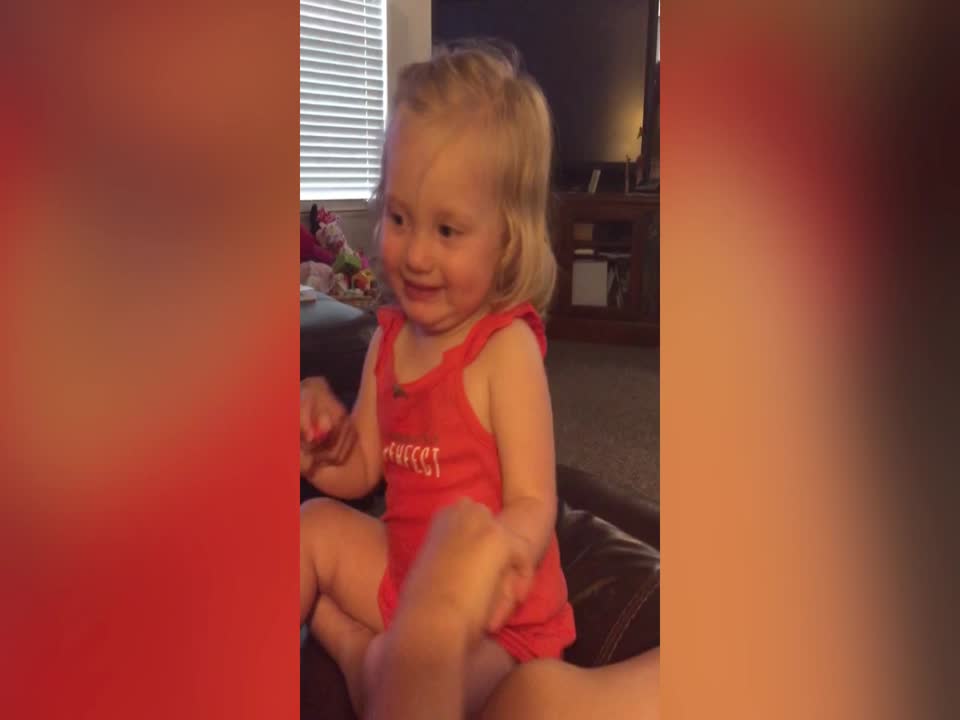 Laughing Little Girl shows off her Serious Side