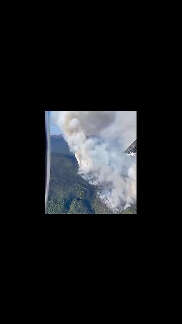 Canada: A Smokejumper plane in British Columbia circles the “jump spot”...
