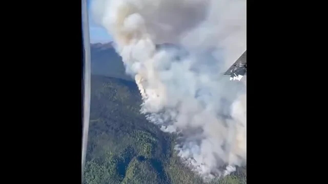 Canada: A Smokejumper plane in British Columbia circles the “jump spot”...