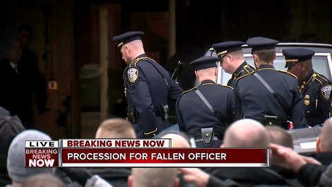 Fallen officer arrives downtown after police procession