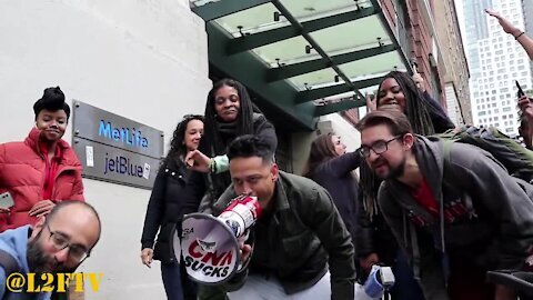 Anti-Mandate protesters dance to Let's Go Brandon in front of JetBlue Headquarters in NYC